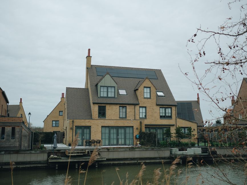 Modern home with residential solar panels installed on the roof